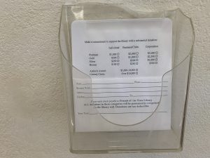 Wall Tree Donation Form in Plastic Holder on Wall