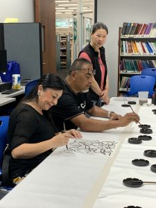 Black ink painting class participants