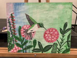 Finished painting of hummingbird with flowers
