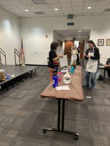 Art class teacher and student