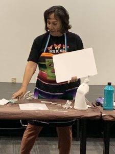 Alma gets student started on the background