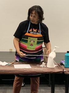 Alma gets student started on the background