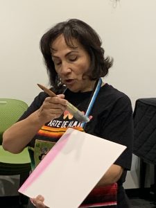 Alma gets student started on the background