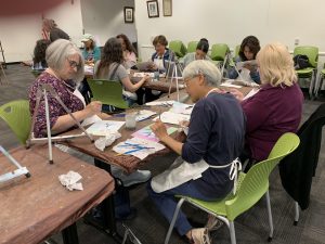 Students painting in Vista Library art class