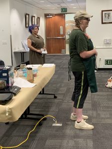 Wendy class instructor with Leslie library staff in background