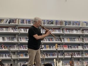 Craig Newton presenting the Joy of Music with his many instruments