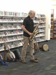 Craig Newton presenting the Joy of Music with his many instruments